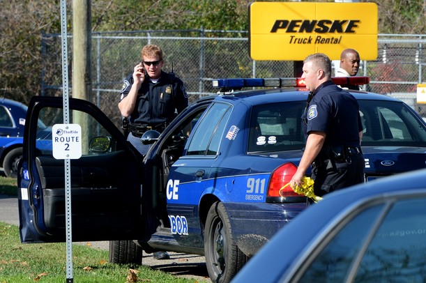 Ann Arbor police work the scene outside of Penske Truck Rental where a vehicle and body were found Thursday. Melanie Maxwell I AnnArbor.com
